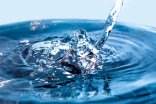 A flowing stream of blue water. Splash of water close-up. Frozen water drop photographed at high speed.Slow dripping of liquid with air bubbles. Nature backgrounds or Wallpaper.Frozen liquid splashes A flowing stream of blue water. Splash of water close-up. Frozen water drop photographed at high speed.Slow dripping of liquid with air bubbles. Nature backgrounds or Wallpaper.Frozen liquid splashes