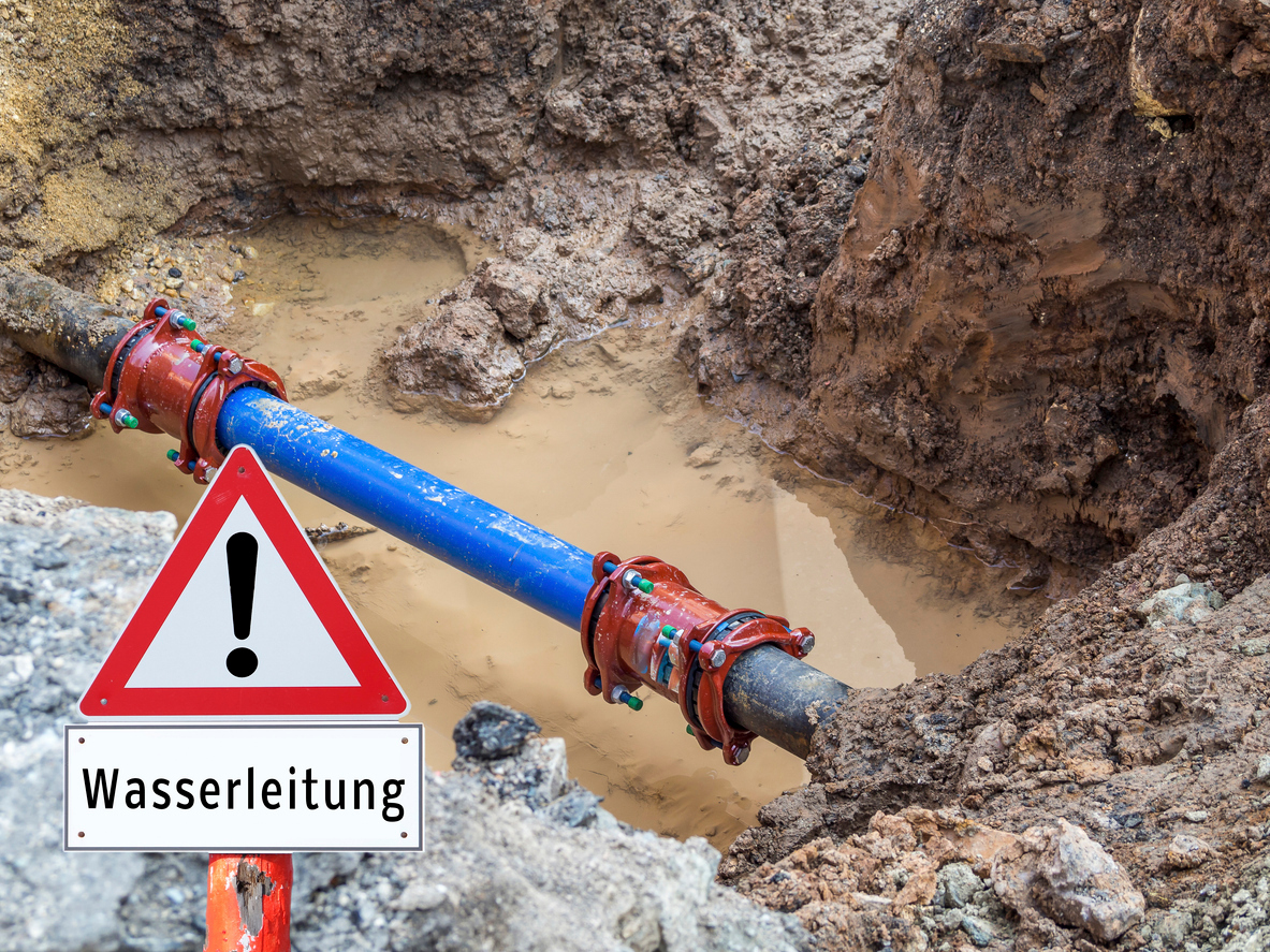 Water pipe burst Warning sign in German Water pipe burst Warning sign in German